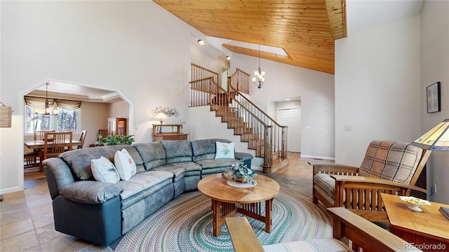 living room featuring arched walkways, wood ceiling, stairway, a high ceiling, and a notable chandelier