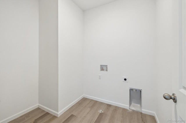 6646 N Nepal St, Aurora, CO 80019 - washroom with light wood finished floors, hookup for an electric dryer, washer hookup, and baseboards