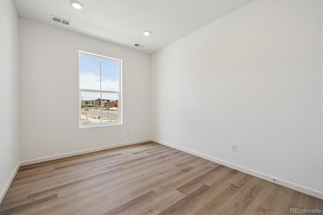 6646 N Nepal St, Aurora, CO 80019 - spare room with light wood-type flooring, baseboards, and recessed lighting
