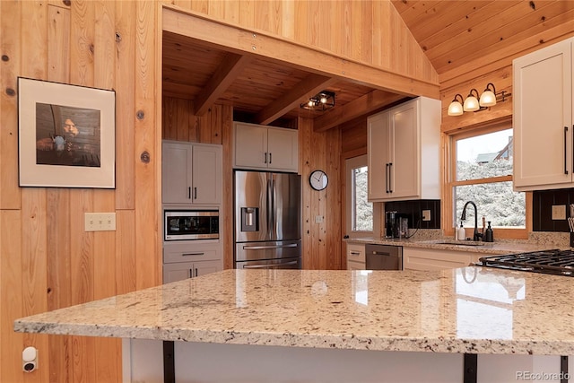 577 Gcr 8952, Granby, CO 80446 - kitchen featuring stainless steel appliances, wood ceiling, wood walls, light stone counters, and white cabinets