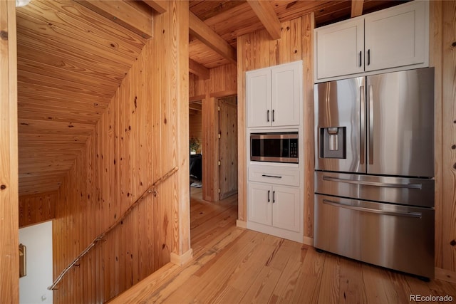 577 Gcr 8952, Granby, CO 80446 - kitchen with stainless steel appliances, wooden ceiling, white cabinets, light wood finished floors, and wood walls
