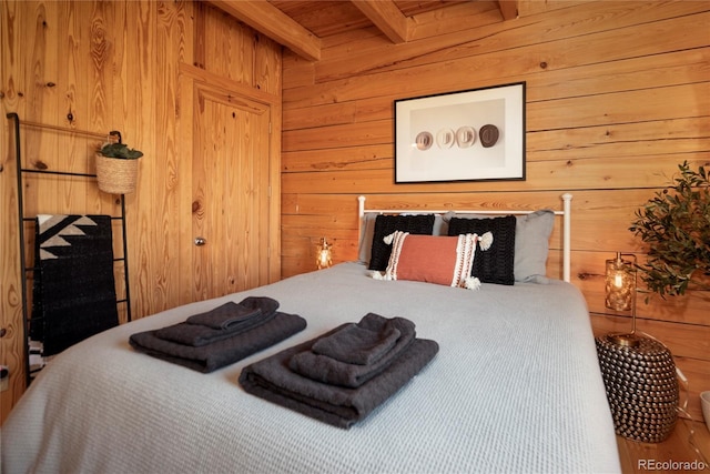 577 Gcr 8952, Granby, CO 80446 - bedroom featuring wood walls and a wooden ceiling with exposed beams