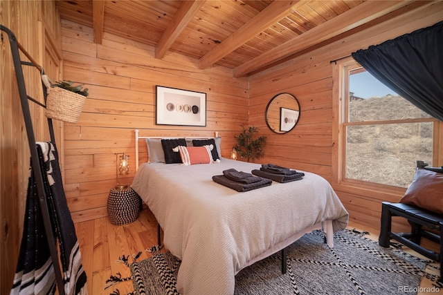 577 Gcr 8952, Granby, CO 80446 - bedroom with a wood ceiling with exposed beams, wood walls, and wood finished floors