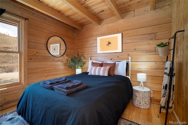 577 Gcr 8952, Granby, CO 80446 - bedroom featuring wooden walls, a wooden ceiling with exposed beams, and wood finished floors