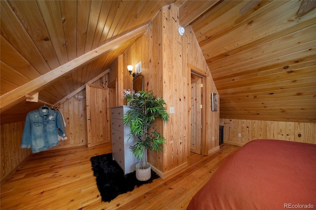 577 Gcr 8952, Granby, CO 80446 - unfurnished bedroom with lofted ceiling, wood walls, wood ceiling, and hardwood / wood-style flooring