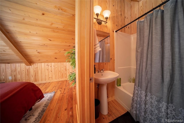 577 Gcr 8952, Granby, CO 80446 - bathroom with wooden walls, shower / bathtub combination with curtain, hardwood / wood-style flooring, and wood ceiling