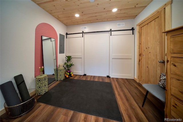 577 Gcr 8952, Granby, CO 80446 - exercise area with electric panel, a barn door, wooden ceiling, dark wood finished floors, and arched walkways