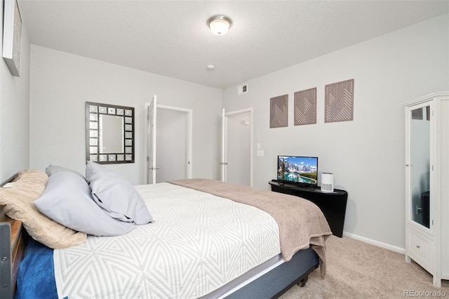 bedroom featuring carpet, visible vents, and baseboards