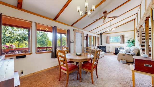 dining area with ceiling fan with notable chandelier, light colored carpet, vaulted ceiling with beams, and a wood stove