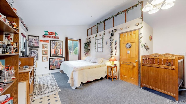 carpeted bedroom featuring lofted ceiling and a chandelier