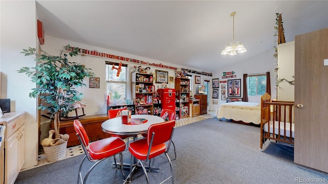 dining room with lofted ceiling, a notable chandelier, and carpet flooring