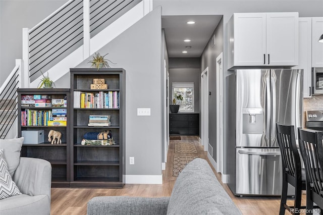 living area with light hardwood / wood-style floors