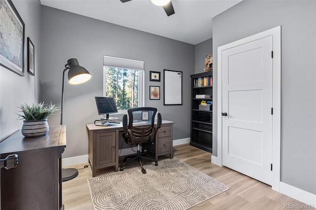 office space with light wood-type flooring and ceiling fan