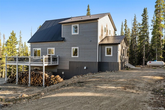 view of property exterior featuring a deck