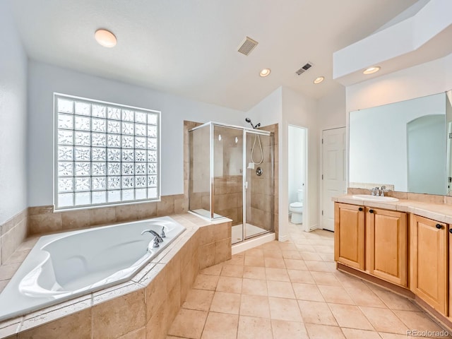 full bathroom with vanity, tile patterned flooring, toilet, and separate shower and tub