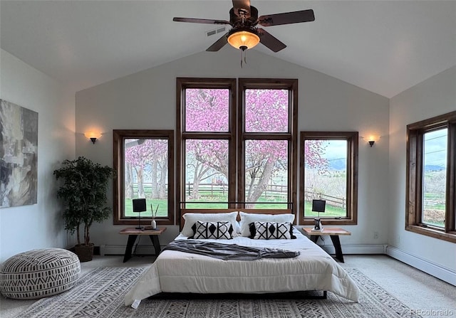 carpeted bedroom with baseboards, vaulted ceiling, and a ceiling fan