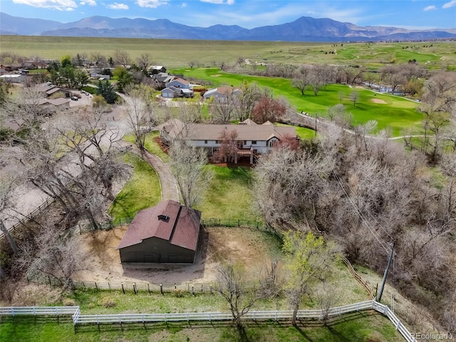 birds eye view of property featuring a mountain view