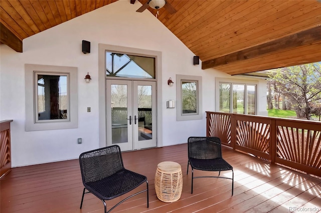 wooden deck with french doors and a ceiling fan