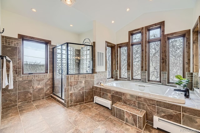 full bath with baseboard heating, a garden tub, a stall shower, and lofted ceiling