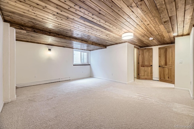 below grade area with baseboards, wooden ceiling, a baseboard heating unit, and light carpet