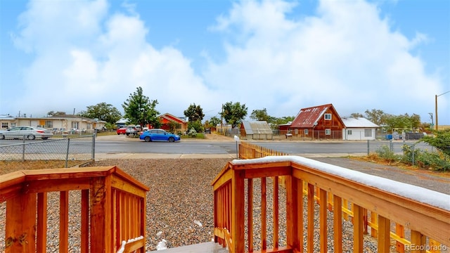 exterior space with fence and a residential view