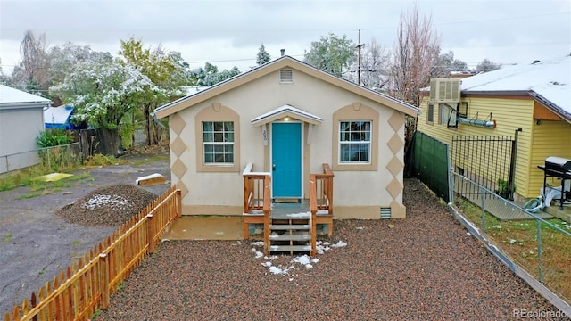 bungalow-style house with central AC