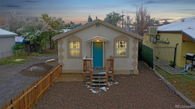 exterior space featuring central air condition unit and a fenced backyard