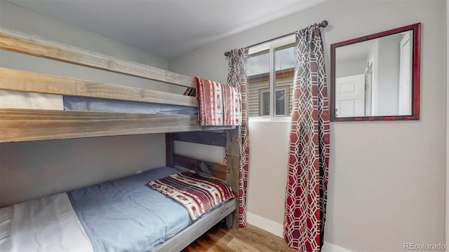 bedroom with wood finished floors