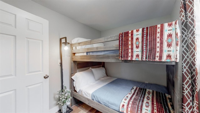 bedroom featuring wood finished floors