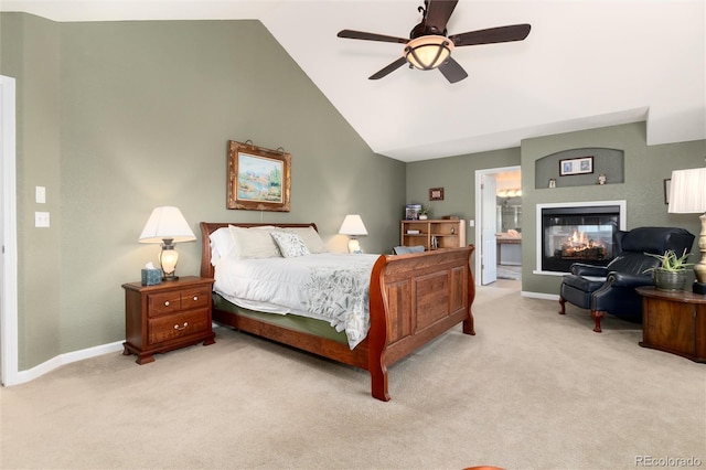 carpeted bedroom with baseboards, vaulted ceiling, a multi sided fireplace, and ceiling fan