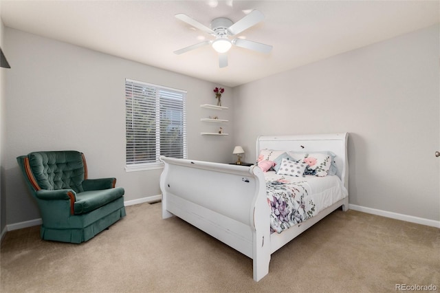 bedroom featuring ceiling fan and carpet