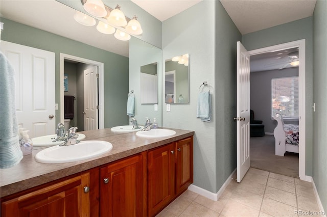 bathroom featuring toilet, tile patterned flooring, ceiling fan, and vanity