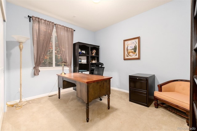 office area with carpet floors, visible vents, and baseboards