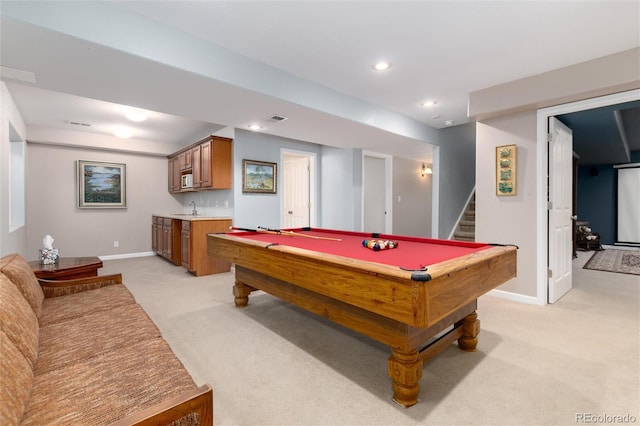 recreation room with wet bar, recessed lighting, a sink, and light colored carpet