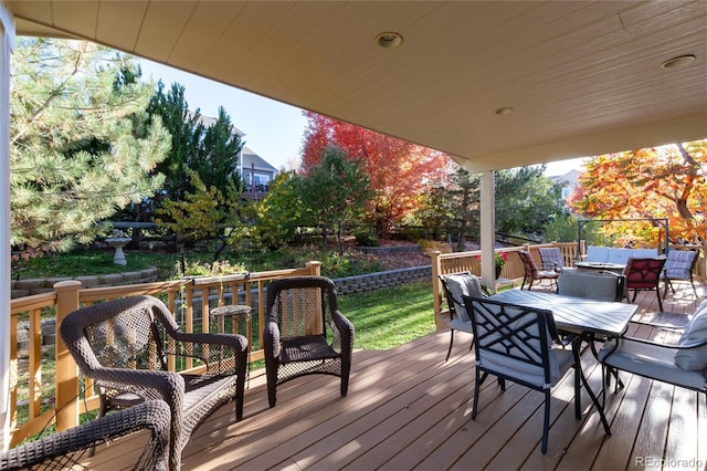 deck with outdoor dining area