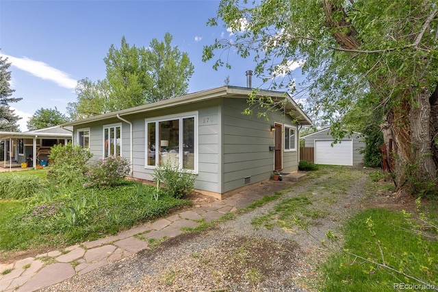 270 31st St, Boulder, CO 80305 - view of side of property featuring dirt driveway, an outbuilding, and a garage