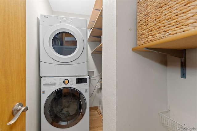 270 31st St, Boulder, CO 80305 - laundry area with estacked washer and dryer and wood finished floors