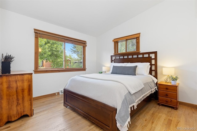 270 31st St, Boulder, CO 80305 - bedroom with multiple windows, light wood-style floors, baseboards, and lofted ceiling