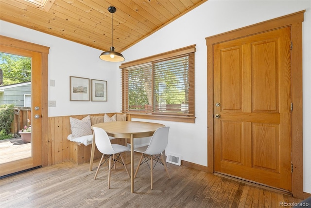 270 31st St, Boulder, CO 80305 - dining space featuring lofted ceiling, wood finished floors, wainscoting, wood ceiling, and wooden walls
