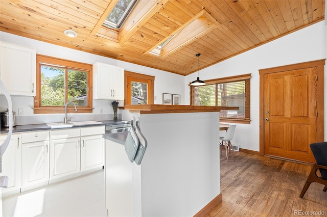 270 31st St, Boulder, CO 80305 - kitchen featuring wood ceiling, a skylight, healthy amount of natural light, lofted ceiling, and a sink