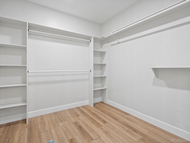 spacious closet with wood finished floors