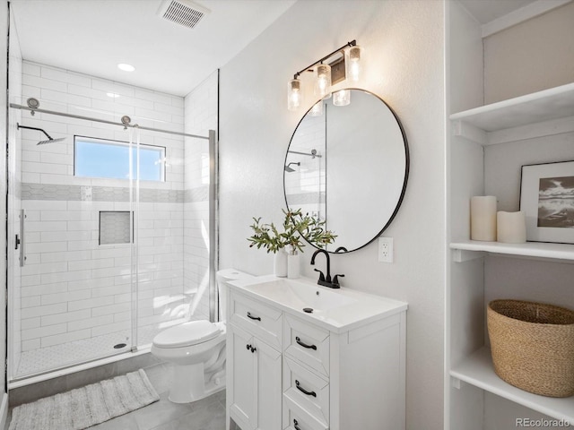 full bathroom featuring a stall shower, visible vents, vanity, and toilet
