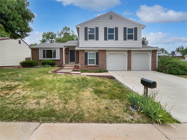 18306 E Gunnison Pl, Aurora, CO 80017 - tri-level home with brick siding, concrete driveway, and a garage