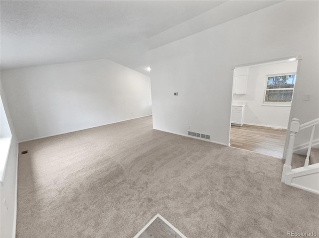 18306 E Gunnison Pl, Aurora, CO 80017 - bonus room featuring light carpet and vaulted ceiling