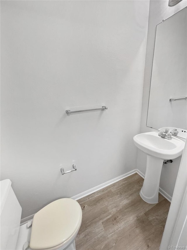 18306 E Gunnison Pl, Aurora, CO 80017 - half bath with toilet and wood finished floors