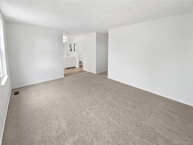 18306 E Gunnison Pl, Aurora, CO 80017 - unfurnished room featuring carpet flooring and a textured ceiling