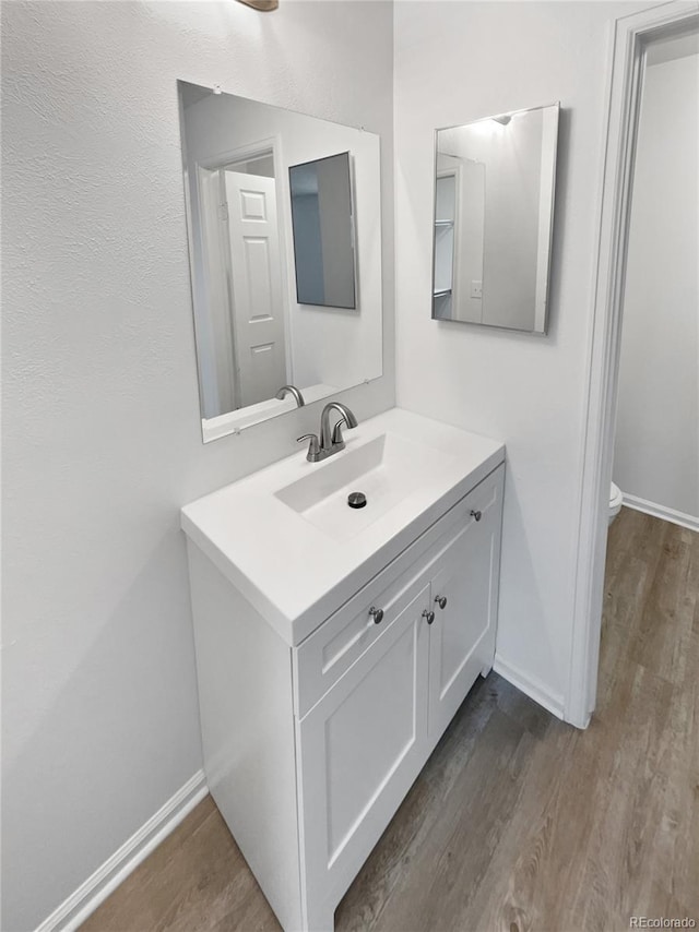 18306 E Gunnison Pl, Aurora, CO 80017 - bathroom with vanity and wood finished floors