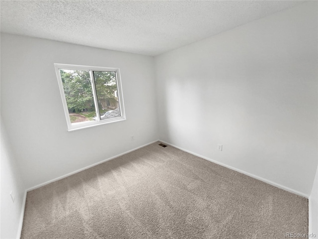 18306 E Gunnison Pl, Aurora, CO 80017 - spare room featuring carpet and a textured ceiling