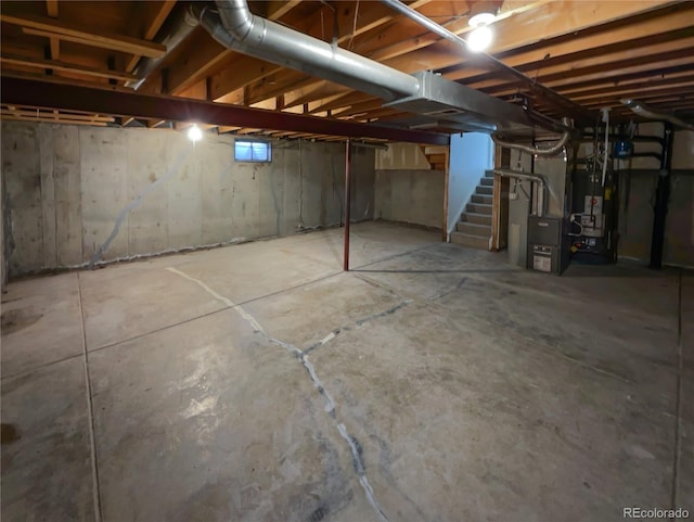 18306 E Gunnison Pl, Aurora, CO 80017 - basement featuring stairs, water heater, and heating unit