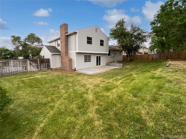 18306 E Gunnison Pl, Aurora, CO 80017 - back of property featuring a patio, a fenced backyard, and a chimney